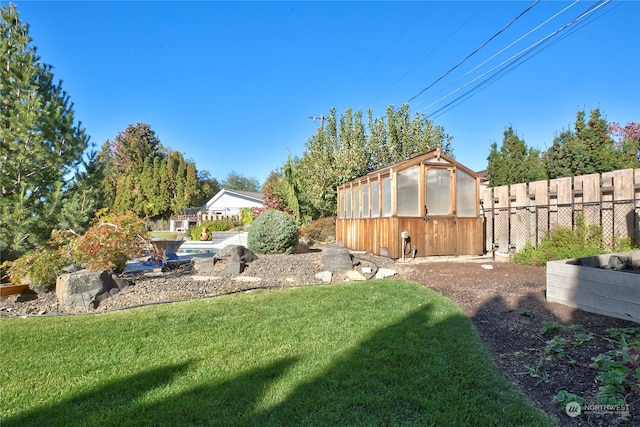 view of yard featuring a storage unit