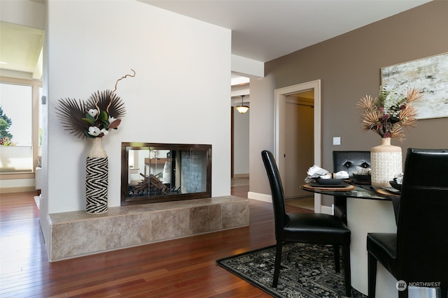 office with a fireplace and hardwood / wood-style flooring