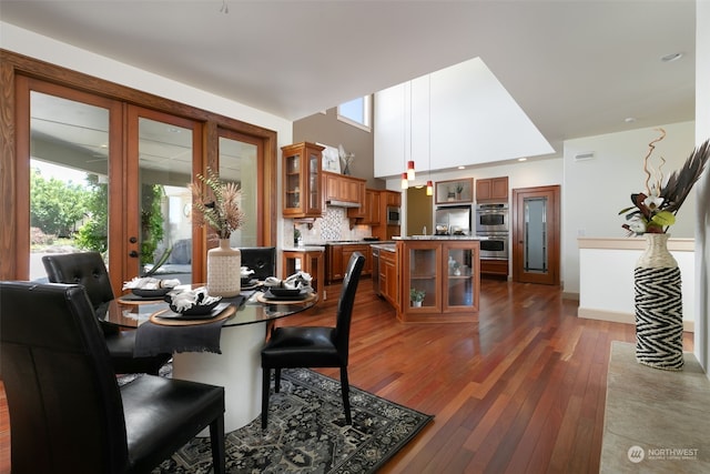 dining area with dark hardwood / wood-style floors and french doors