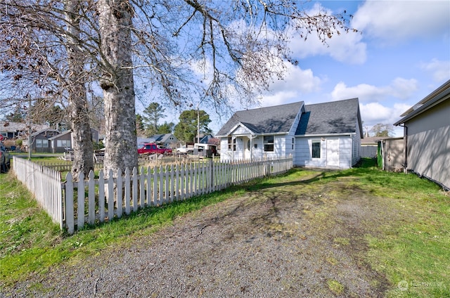 rear view of property with a yard