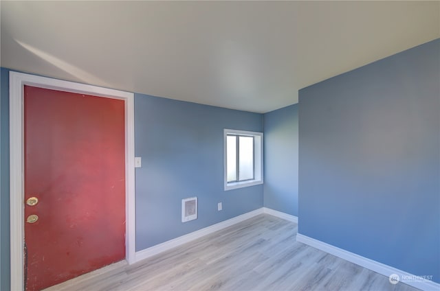 unfurnished room featuring light hardwood / wood-style flooring