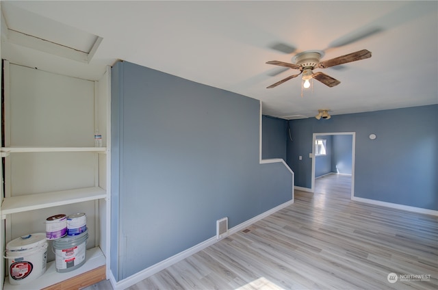 spare room with light hardwood / wood-style floors and ceiling fan