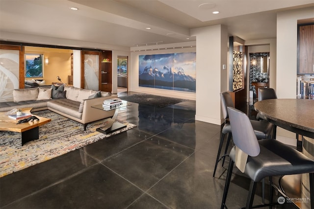 living room with dark tile flooring