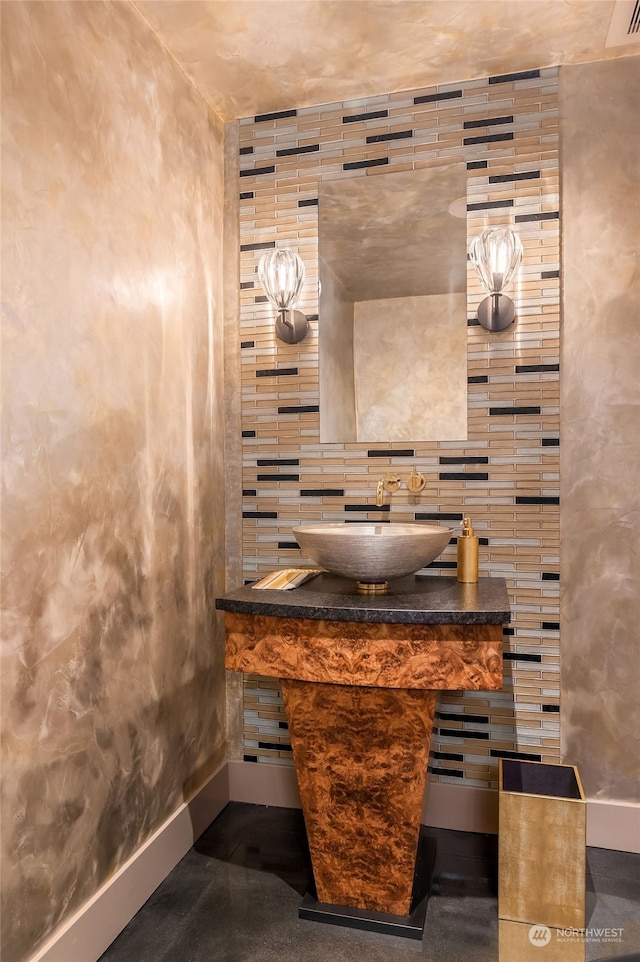 bathroom with tile walls, backsplash, and vanity with extensive cabinet space