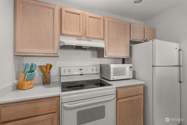 kitchen featuring light brown cabinets and white appliances