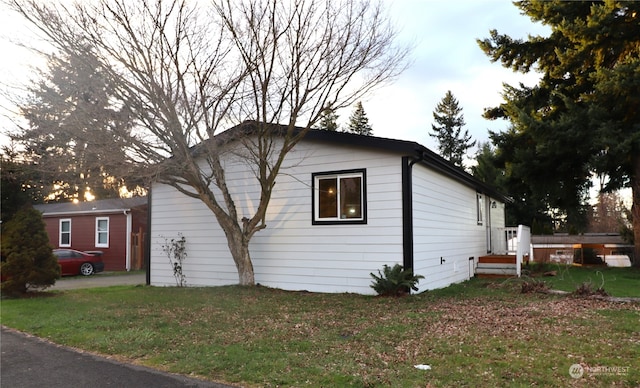 view of property exterior featuring a yard