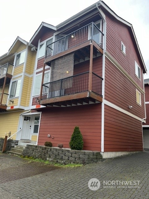 view of property exterior featuring a balcony