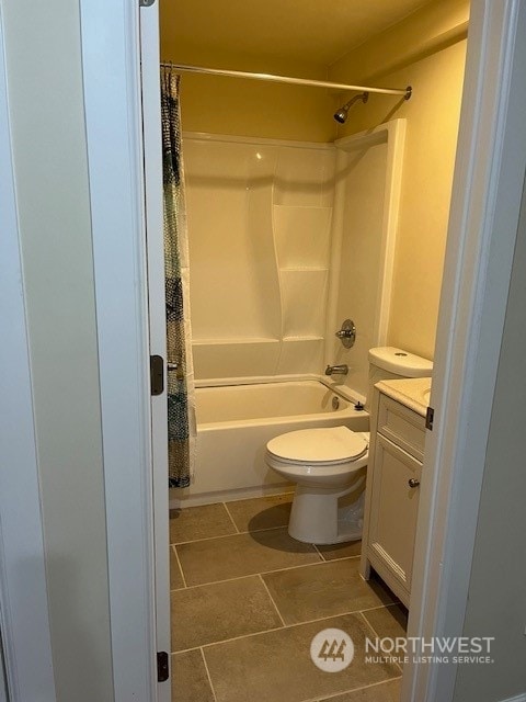 full bathroom with toilet, shower / bath combo with shower curtain, vanity, and tile flooring