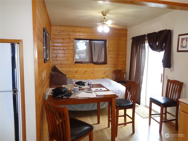 dining area featuring ceiling fan, light hardwood / wood-style flooring, and a healthy amount of sunlight