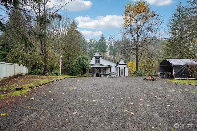 exterior space with a carport and a porch