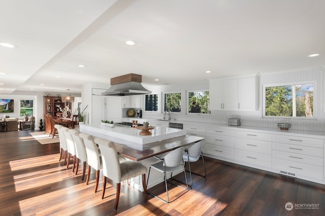 dining room with sink and hardwood / wood-style flooring