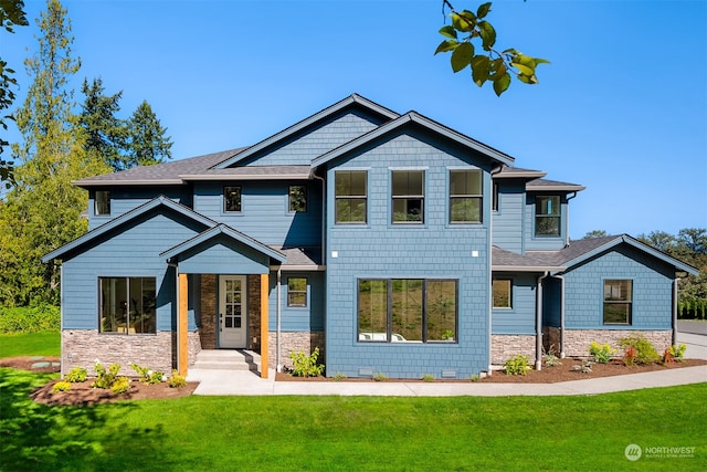 craftsman-style house featuring a front lawn