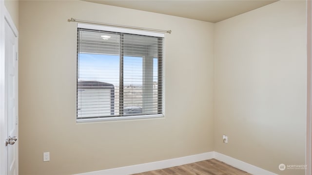 spare room featuring light hardwood / wood-style floors