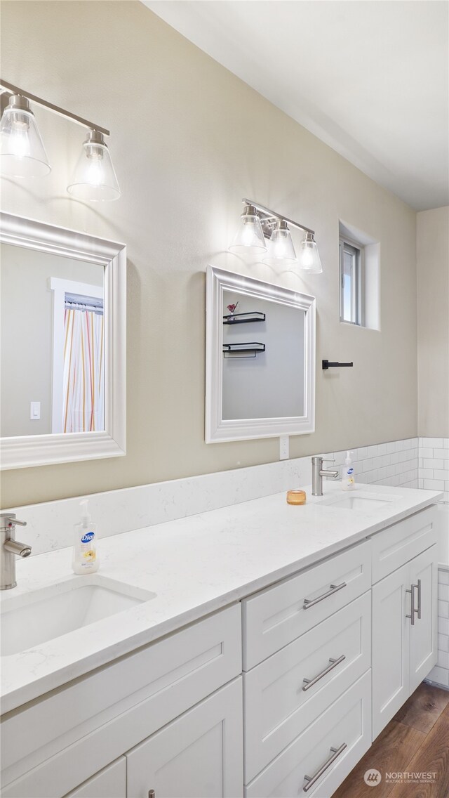 bathroom featuring vanity and wood-type flooring