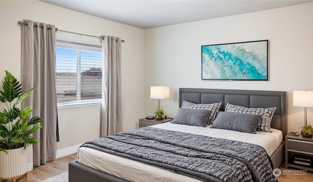 bedroom with light wood-type flooring