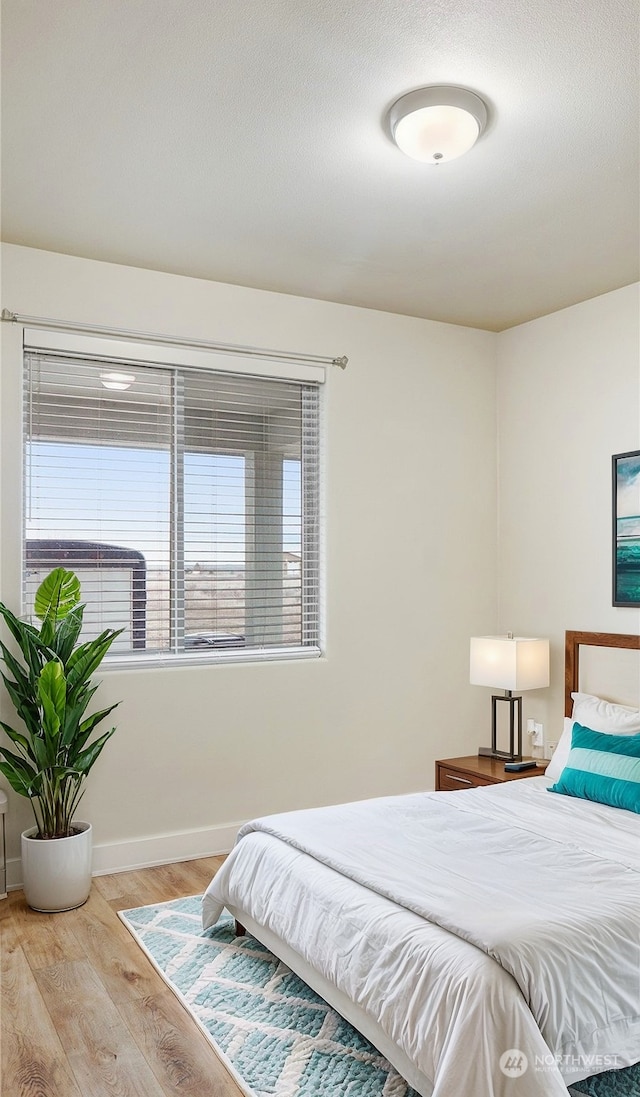 bedroom featuring light hardwood / wood-style floors