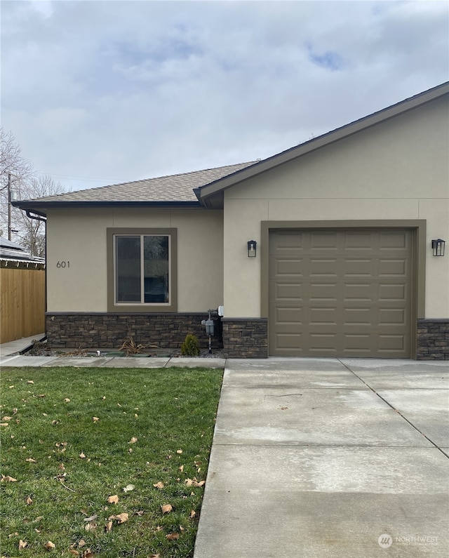 ranch-style house with a front lawn and a garage