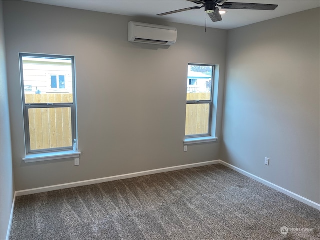 unfurnished room with plenty of natural light, dark colored carpet, ceiling fan, and a wall mounted air conditioner