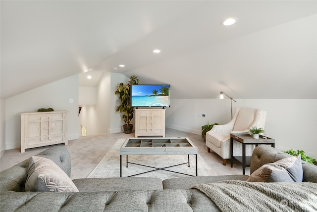 carpeted living room with lofted ceiling