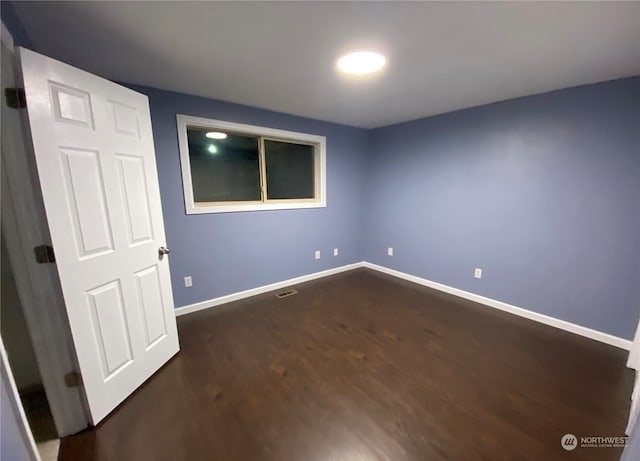 interior space with dark hardwood / wood-style floors