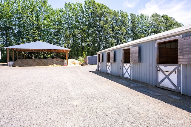 view of home's exterior with an outdoor structure