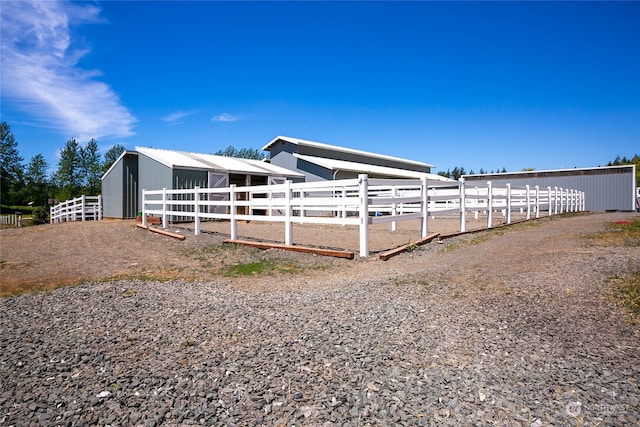 view of side of property featuring an outdoor structure