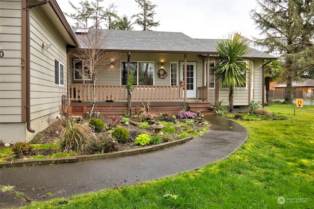 ranch-style home with a porch and a front lawn