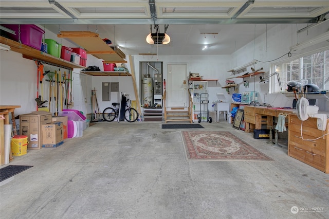 garage with a workshop area and a garage door opener