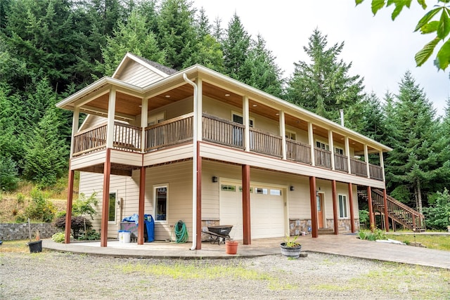 view of front facade featuring a balcony and a garage