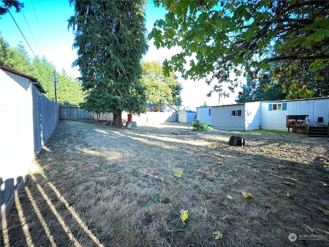 view of yard featuring a wooden deck