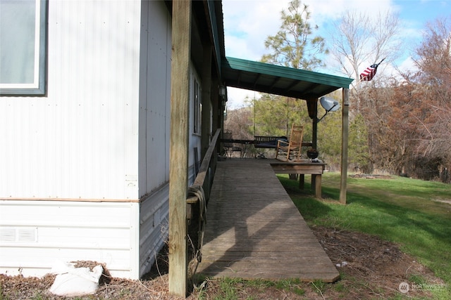 exterior space with a lawn and a deck