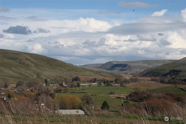 view of mountain feature with a rural view