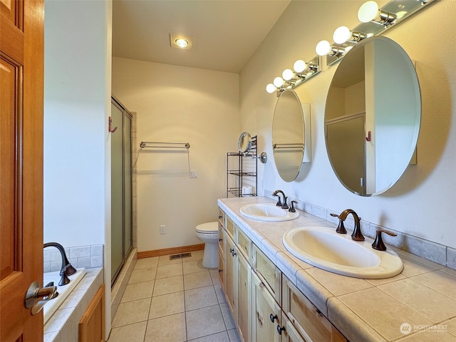 full bathroom with dual bowl vanity, toilet, tile flooring, and plus walk in shower