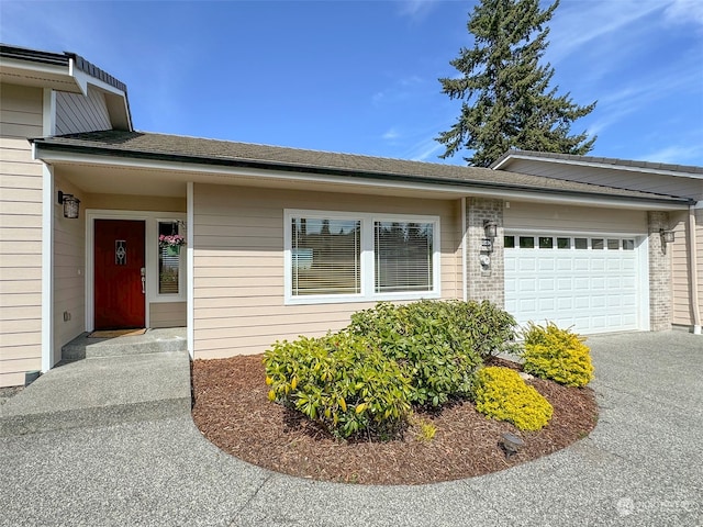 view of front of property with a garage