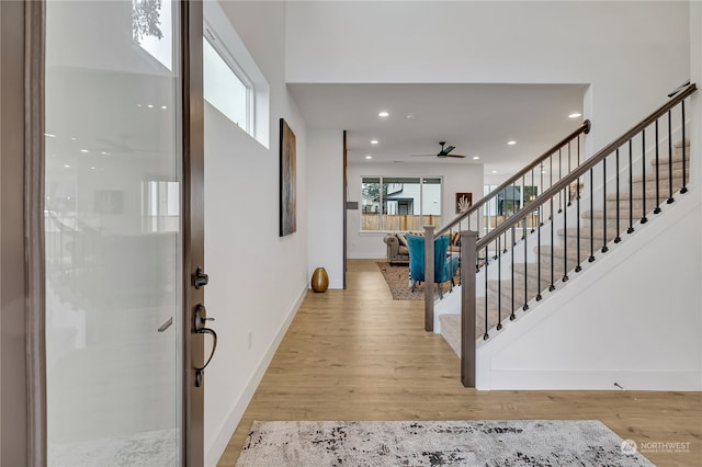 entrance foyer featuring plenty of natural light and light hardwood / wood-style floors