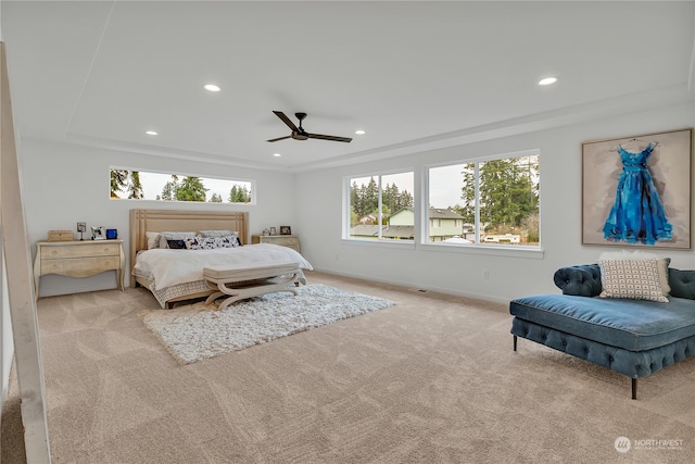 carpeted bedroom with multiple windows, ceiling fan, and crown molding