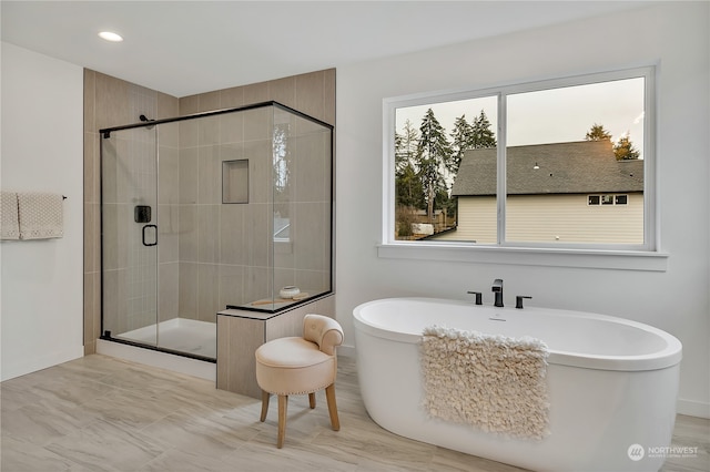 bathroom with independent shower and bath