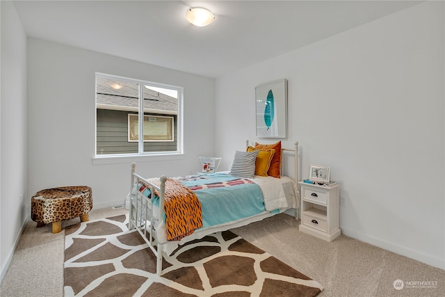 bedroom with light carpet