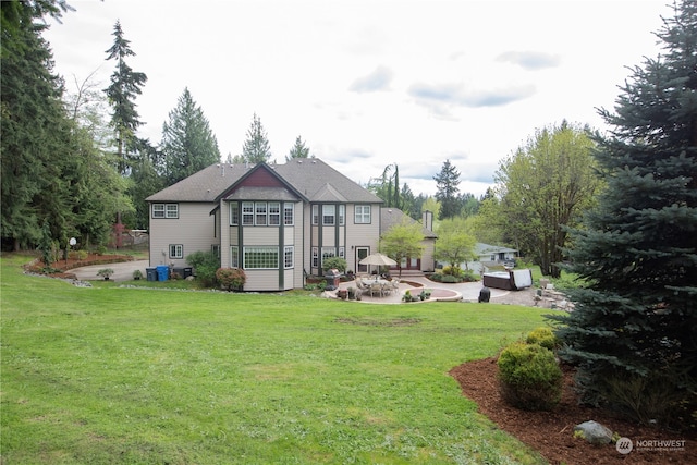 exterior space with a lawn and a patio area