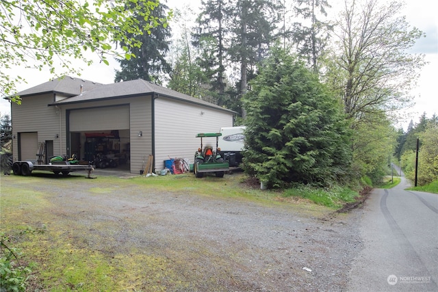 view of side of property featuring a garage