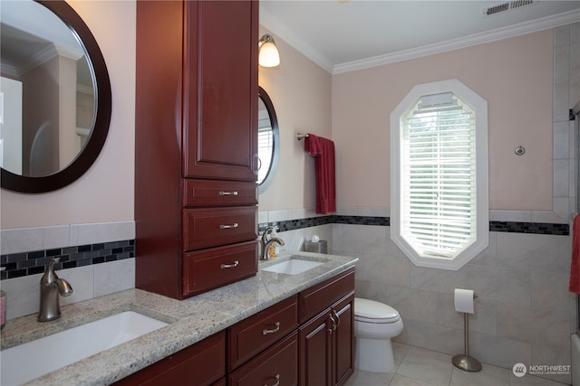 bathroom featuring double sink, tile walls, tile flooring, toilet, and oversized vanity