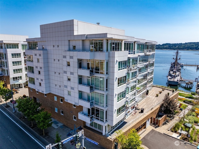 view of building exterior with a water view