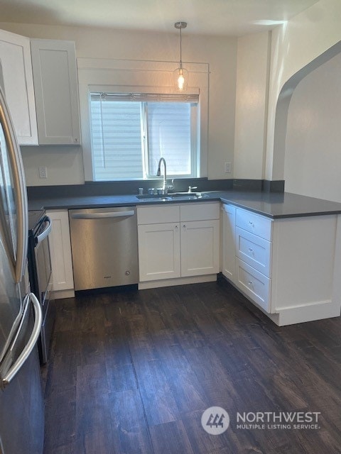 kitchen featuring white cabinets, sink, and stainless steel appliances