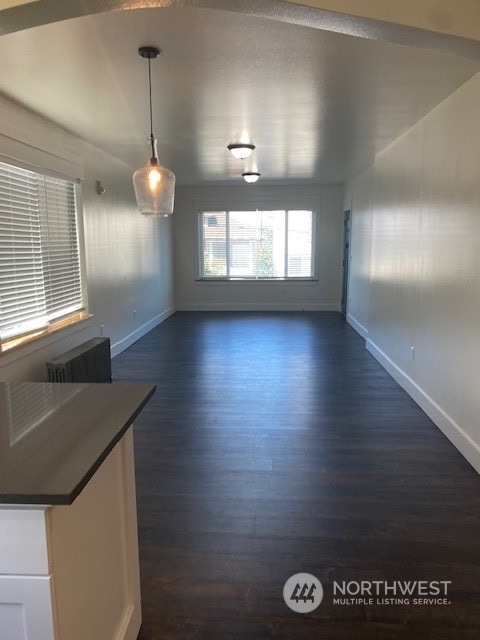 spare room featuring dark hardwood / wood-style floors