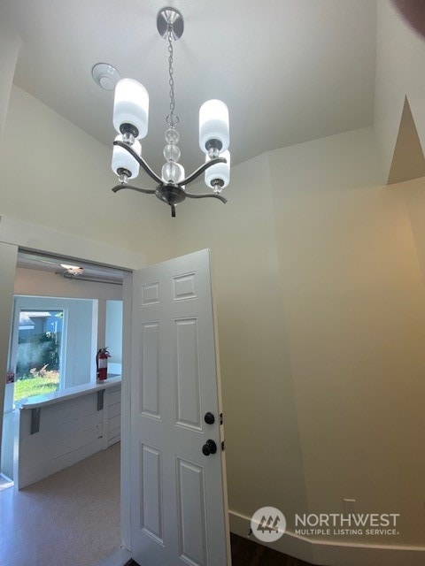 details featuring carpet flooring and a notable chandelier