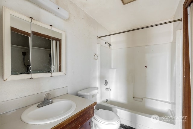 full bathroom featuring toilet, bathtub / shower combination, and vanity