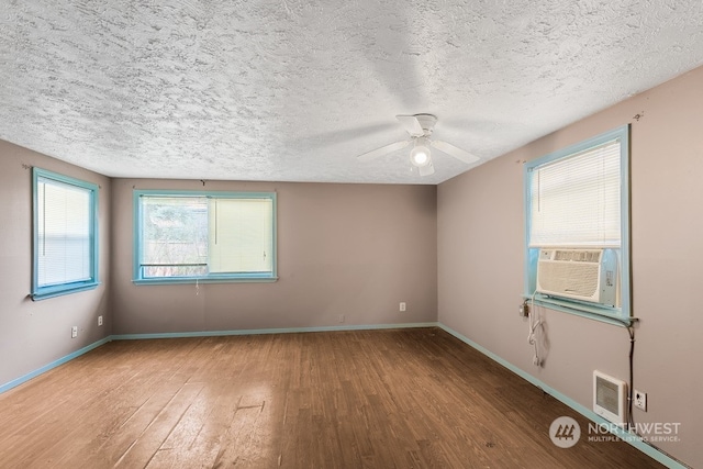 unfurnished room with hardwood / wood-style floors, a textured ceiling, and ceiling fan