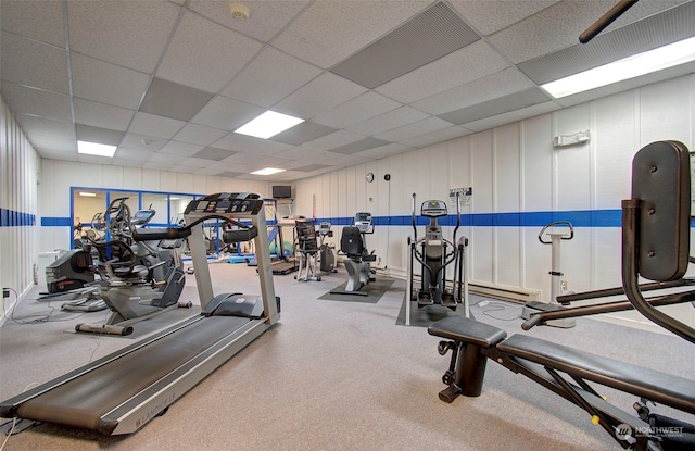 workout area featuring a paneled ceiling