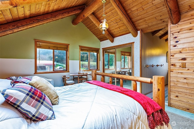 bedroom with lofted ceiling with beams, carpet, and wooden ceiling