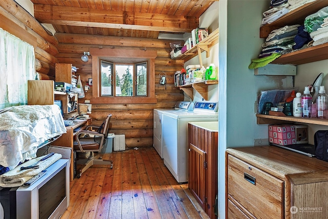 laundry area featuring wood-type flooring, washing machine and dryer, and wooden ceiling